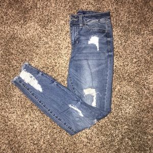 Distressed denim jeans